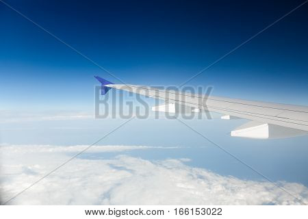 sky as seen through window of an aircraft
