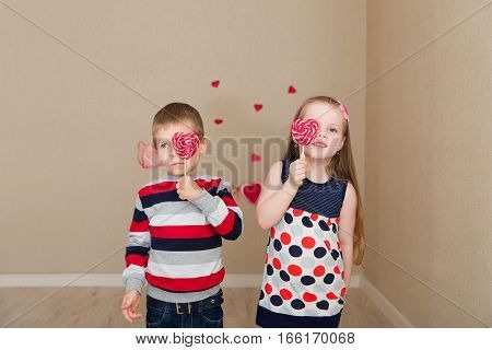 Beautiful Boy And Girl On The Background Of Hearts