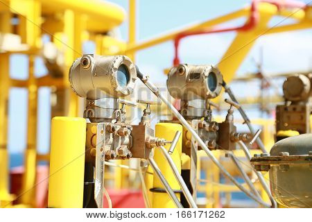 Pressure transmitter in oil and gas process, Send signal to controller and reading pressure in the system, Electronic transducer and sent data from production process to Processor Logic Controller.