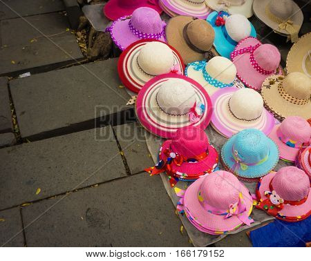 Pinky millinery and hats sold on the ground at Kota Tua Museum Area photo taken in Jakarta Indonesia java