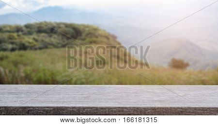 product display montage of Empty wooden table and blurred mountian view or forest background