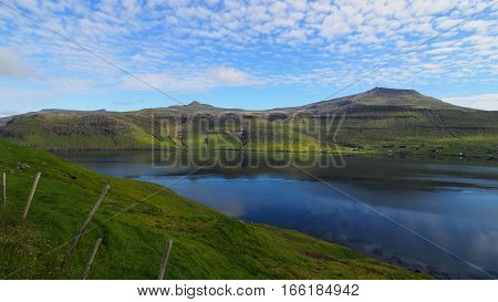 Thin clouds cast shadows over the Faroe Islands