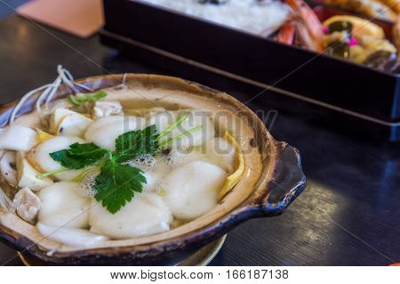 Traditional Shimabara Guzoni - Soup With Rice Cake And Seafood