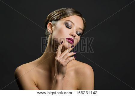 Portrait of a beautiful woman on a dark background