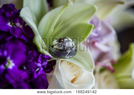 Wedding ring bands inside a lillie flowers