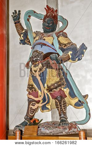China Hangzhou. Monastery Soul SanctuaryTemple (Lininsy). Hall of Heavenly Rulers. Sculptural figure personifying the Guardians of the Zodiac.