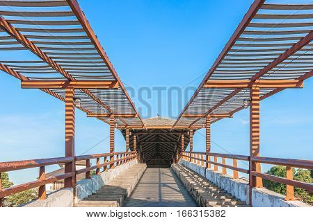 a public bridge at Samchuk Market with a blue sky background.