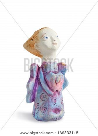 Closeup painting figurine "Angel of tender emotion" from clay pottery isolated on white. Purple angel holding an apple on their hands.