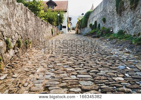 Old cobblestone street located in Aigle Switzerland