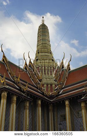 view of famous religion temple wat phra prakaew grand palace in Bangkok Thailand under a blue sky in travel and tourist destination landmark in Asia