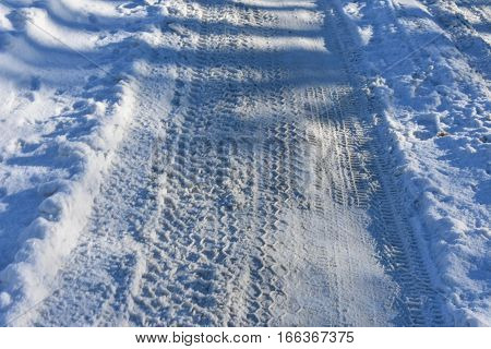 winter cold road numerous traces of the tread wheels the frozen road of snow