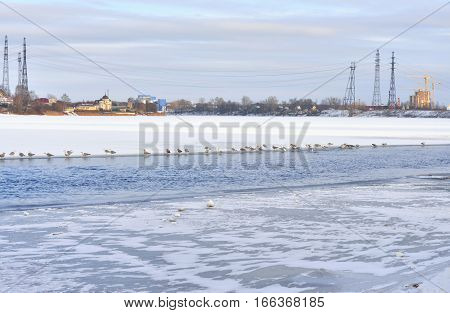 View of Neva River on the outskirts of St. Petersburg at cloud winter day Russia.