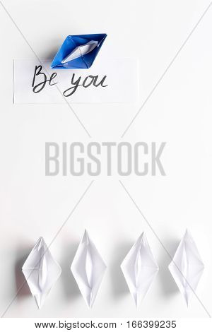 choice concept paper boats on white background top view.
