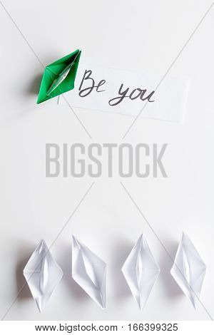 choice concept paper boats on white background top view.