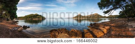 Panoramic view of Formentor beach located among pine forests and stones landmark of Mallorca Balearic islands Spain