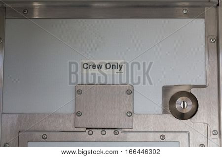 Crew only plate at cabin of modern airplane