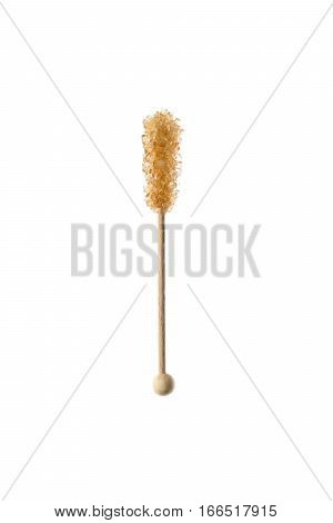 candy caramel brown sugar on a stick on a white background