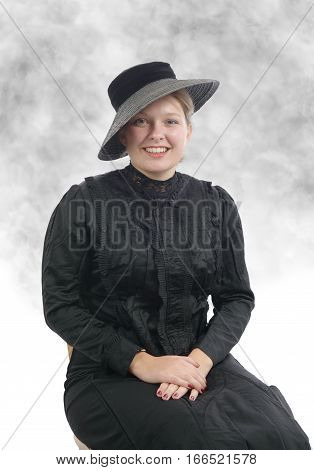 young smiling woman in vintage costume 1900s