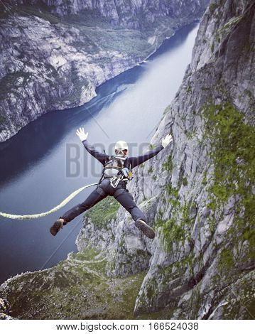 Jump off a cliff into a canyon with a rope.