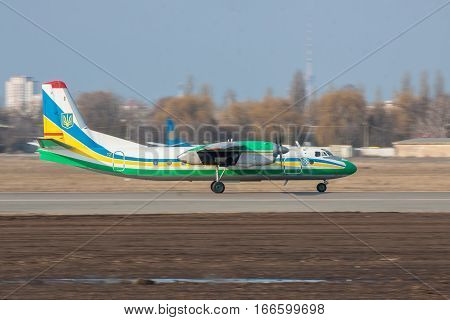 Kiev Ukraine - March 15 2011: Ukraine Border Guard Antonov An-24RV plane taxiing along the runway