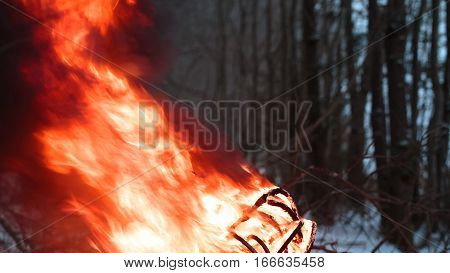 wires on fire. Firing winding insulation of electrical wiring in the fire in the winter woods