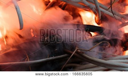 wires on fire. Firing winding insulation of electrical wiring in the fire close-up