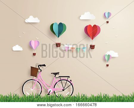 Pink bikes parked on the grass with heart shaped balloons  floating on the sky.paper art and origami style.