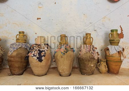 Ceramic pots and jars in interior of residential caves of troglodyte in Matmata, Tunisia, Africa