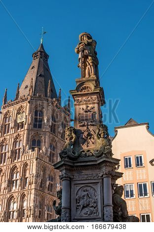 Cologne, Germany - January 19, 2017: Tower City Hall. At the Town Hall Square are all great celebrations and Cologne event. The foreground fragment of the fountain-monument of Jan von Werth.
