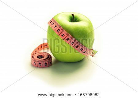 Green apple with centimeter - losing weight. isolated
