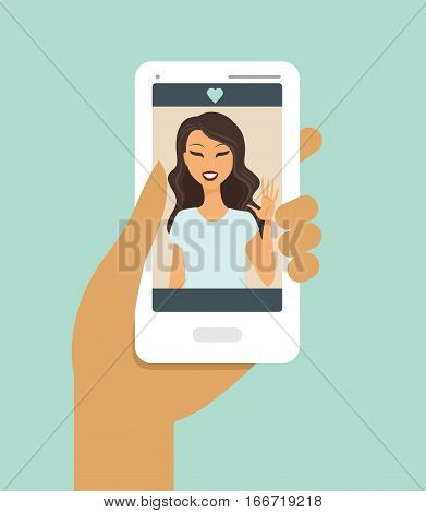 Closeup of a hand holding smartphone during a video call