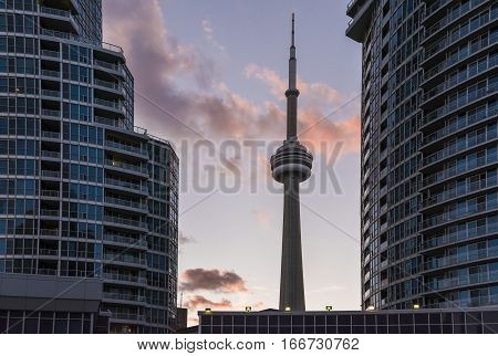 TORONTO,CANADA-AUGUST 2,2015:view of the CN tower in Toronto during a sunset from one of the central street of the city near the union station.