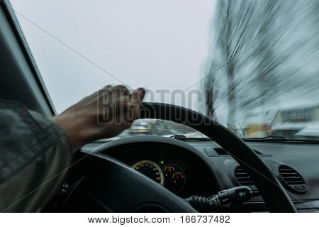 Riding behind the wheel of a car in winter. first-person view
