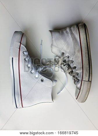 New Shoe and old Shoe tied with shoelaces on white background