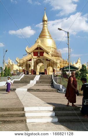 Yangon Myanmar - 9 January 2010: People walking in the area of the Maha Wizaya Paya Pagoda in Yangon on Myanmar