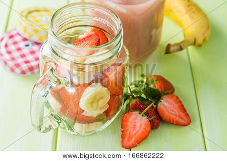 Banana and strawberry smoothie, inredients, copy space