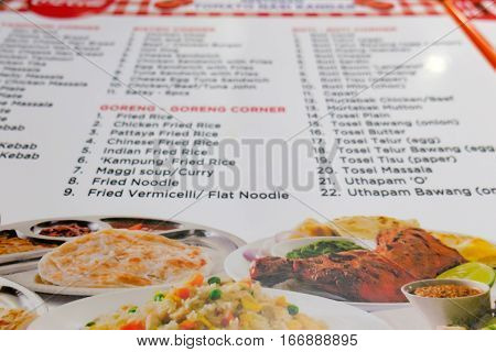 Photo menu of local beach restaurant with popular dishes from Indian cuisine, Langkawi island, Malaysia