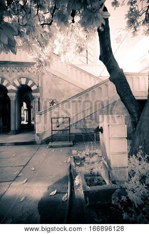 an infrared view of a building located at the 'cimitero monumentale' in milan