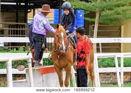 Tuaran,Sabah,Malaysia-Jan 22,2017:Visitor ready to riding a horse in Sabandar Leisure Rides,it is Sabah's attraction for lovers of the Wild West who want to experience horse riding within a paddock