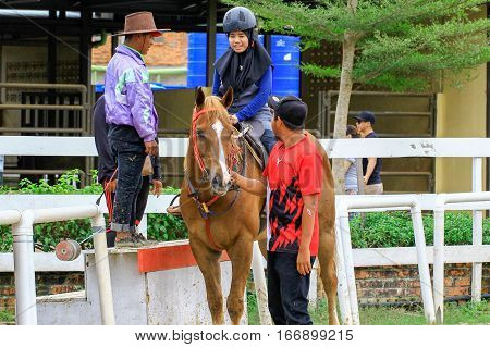 Tuaran,Sabah,Malaysia-Jan 22,2017:Visitor ready to riding a horse in Sabandar Leisure Rides,it is Sabah's attraction for lovers of the Wild West who want to experience horse riding within a paddock