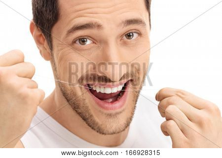 Man flossing his teeth isolated on white background