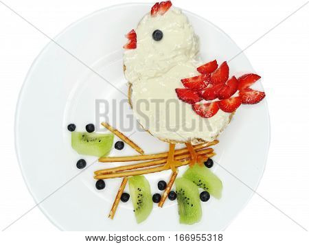 creative breakfast food with fruit and chocolate sweet cream on bread