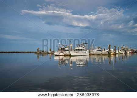 Steveston Harbor Morning Reflections. The Steveston Commercial Fish Docks On The Banks Of The Fraser