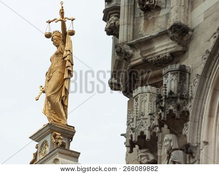 Statue Of Justice On The Facade Of The House In Burg Square