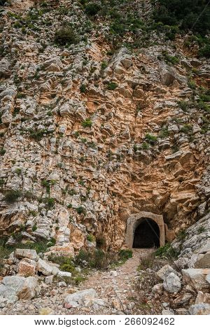 Entrance To The Tunnel Cut Out Inside The Rock On The Coastal Walking Path In Petrovac, Montenegro
