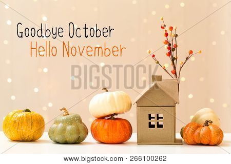 Goodbye October Hello November Message With Collection Of Autumn Pumpkins With A Toy House