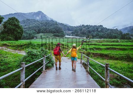 Lover Asian Man Asian Women Travel Nature. Walking A Photo The Rice Field And Stop Take A Break Rela