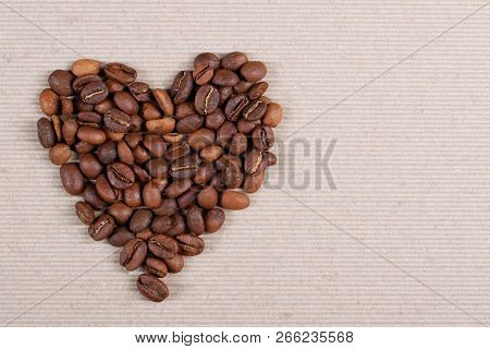 Roasted Coffee Beans Forming A Heart Shape.