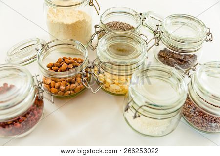 An overhead view of ingredients for making oatmeal in the glass jar