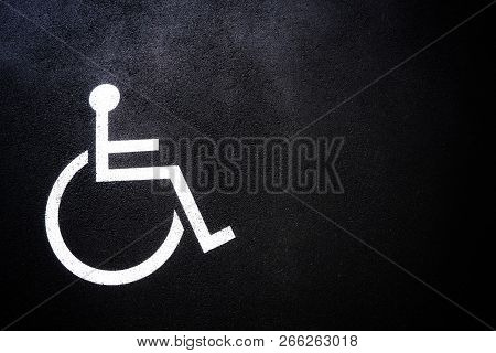 Disabled People Icon Or Handicap Symbol On Parking Space.sign Design On Urban Asphalt Road.wheel Cha
